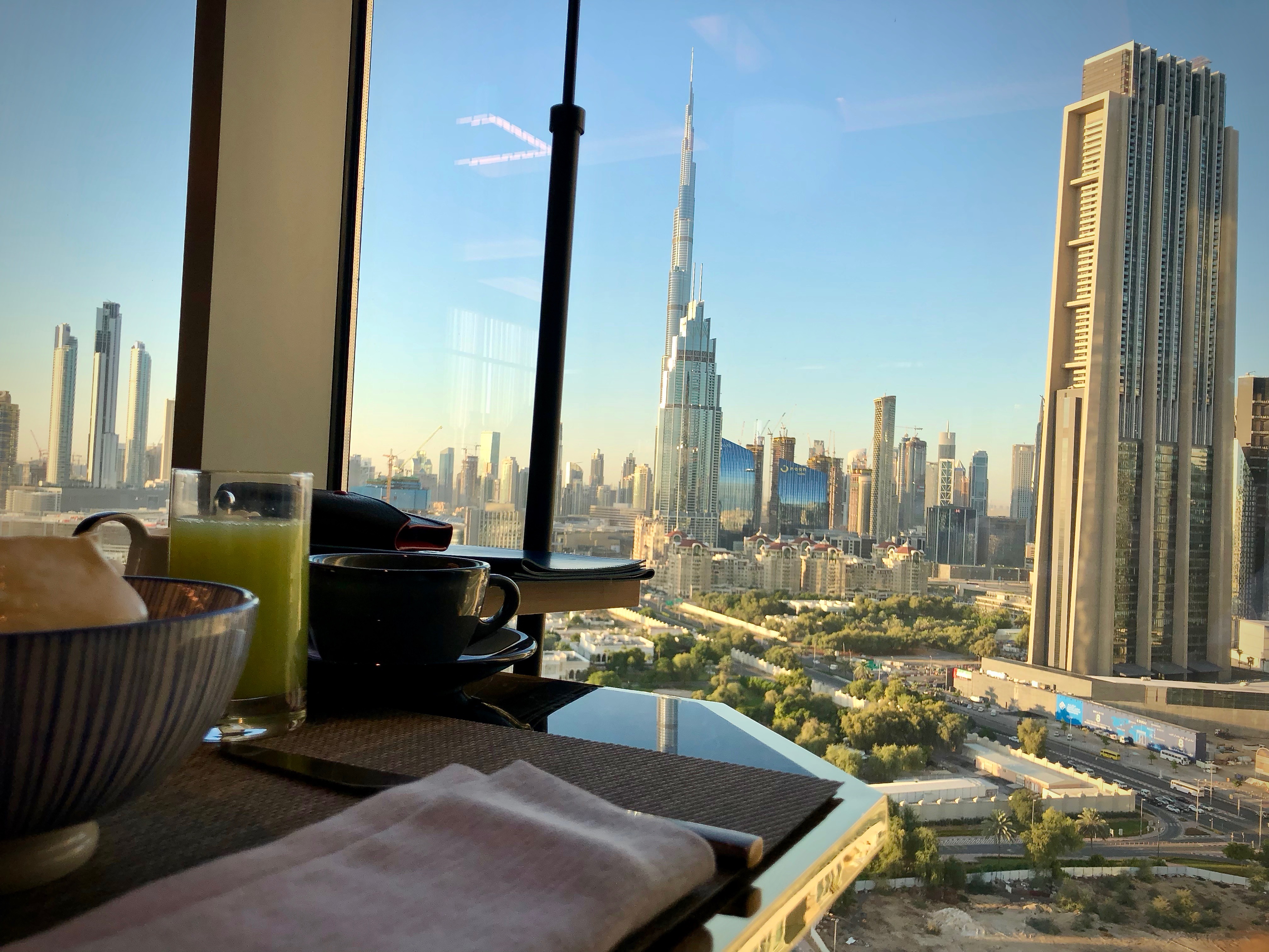 a table with a view of a city and a skyscraper
