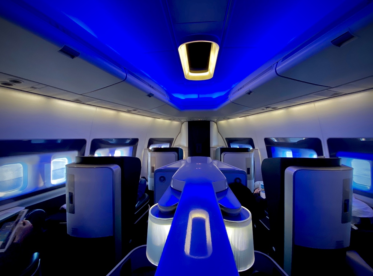 a blue and white interior of an airplane