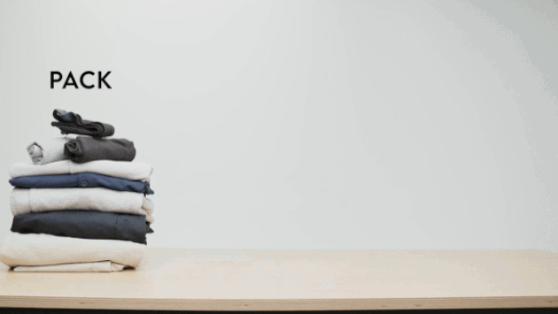 a stack of folded clothes on a table