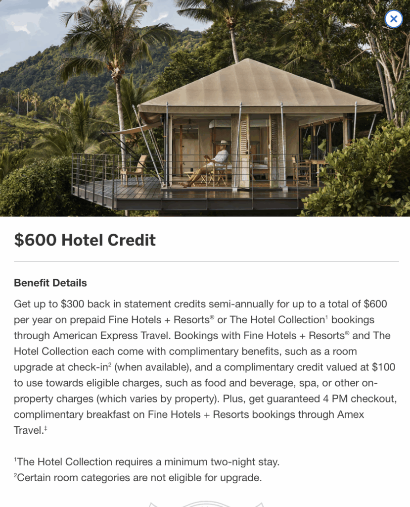 a person sitting on a deck in front of a hotel