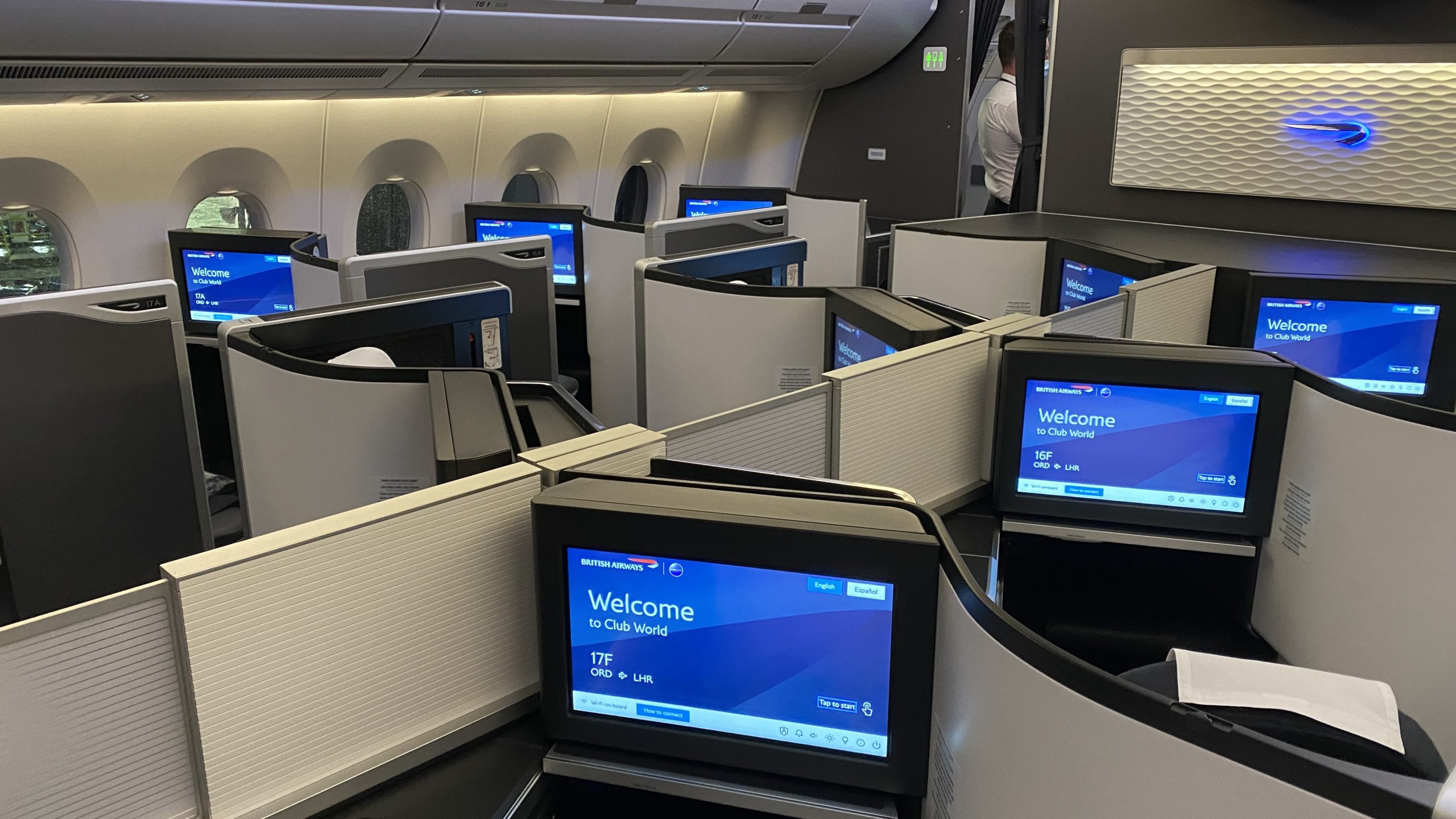a group of computer screens in an airplane