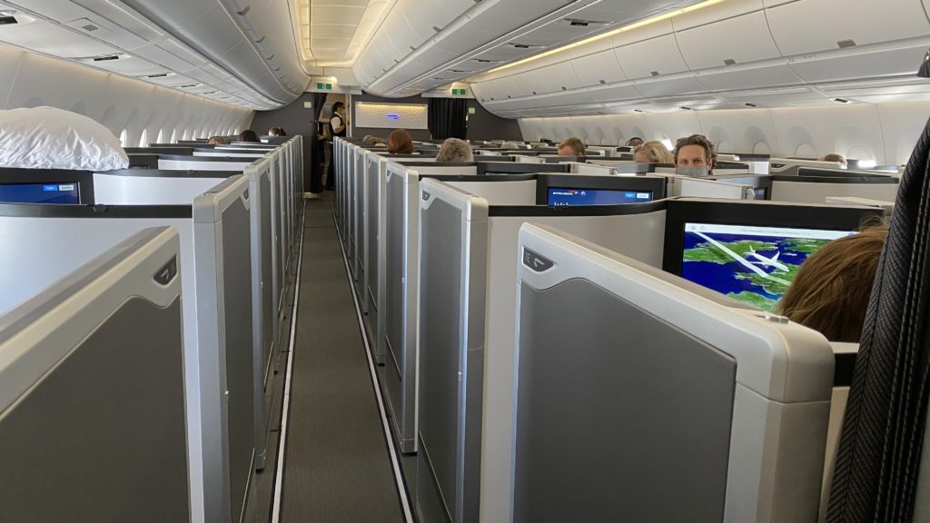 a group of people sitting in an airplane