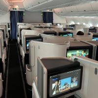 a plane with rows of tvs and seats