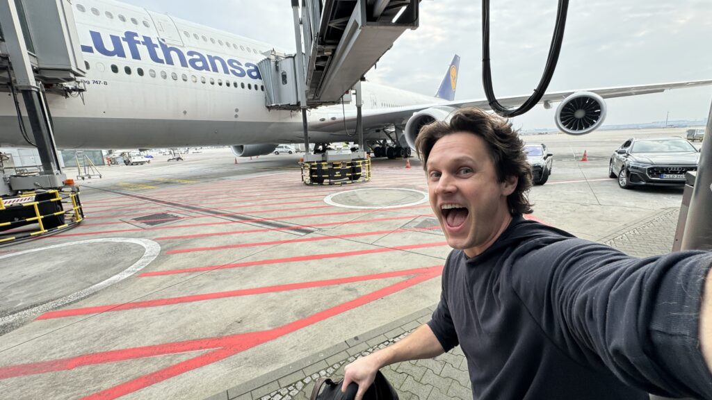 a man taking a selfie with an airplane