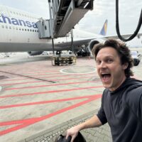 a man taking a selfie with an airplane