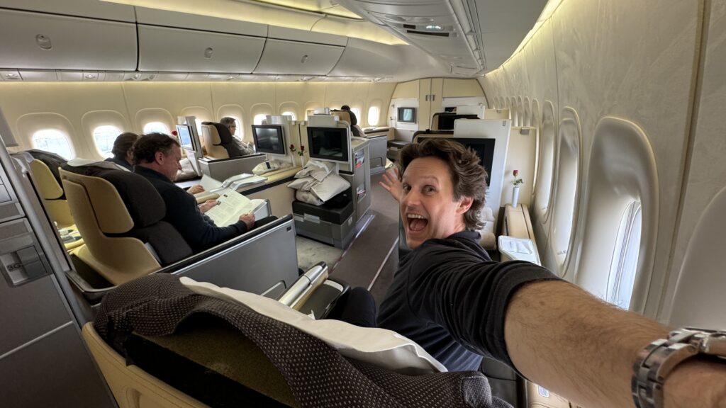 a man taking a selfie in an airplane