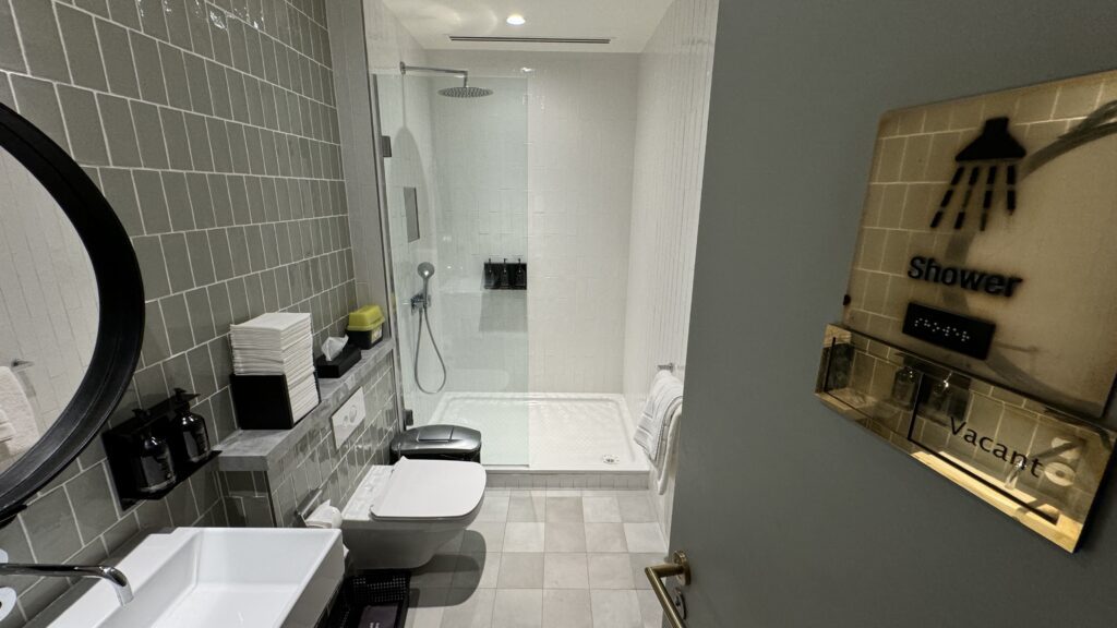 a bathroom with a shower and toilet