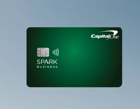 a green credit card with white text