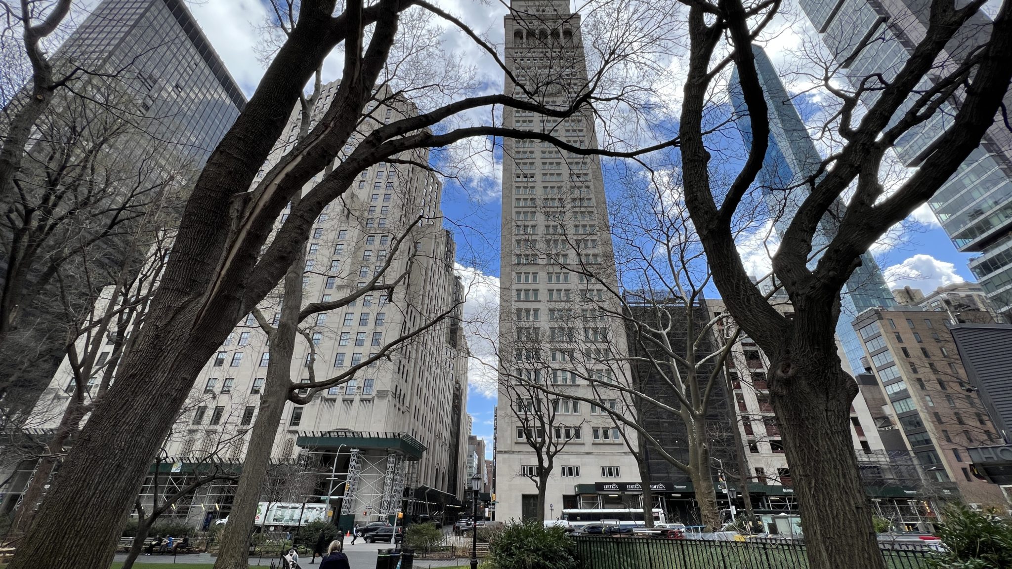 a tall building with trees in front of it