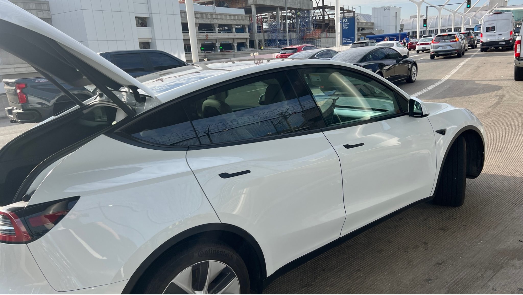 a white car with its trunk open