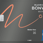 a credit card with a logo and a line of orange lines