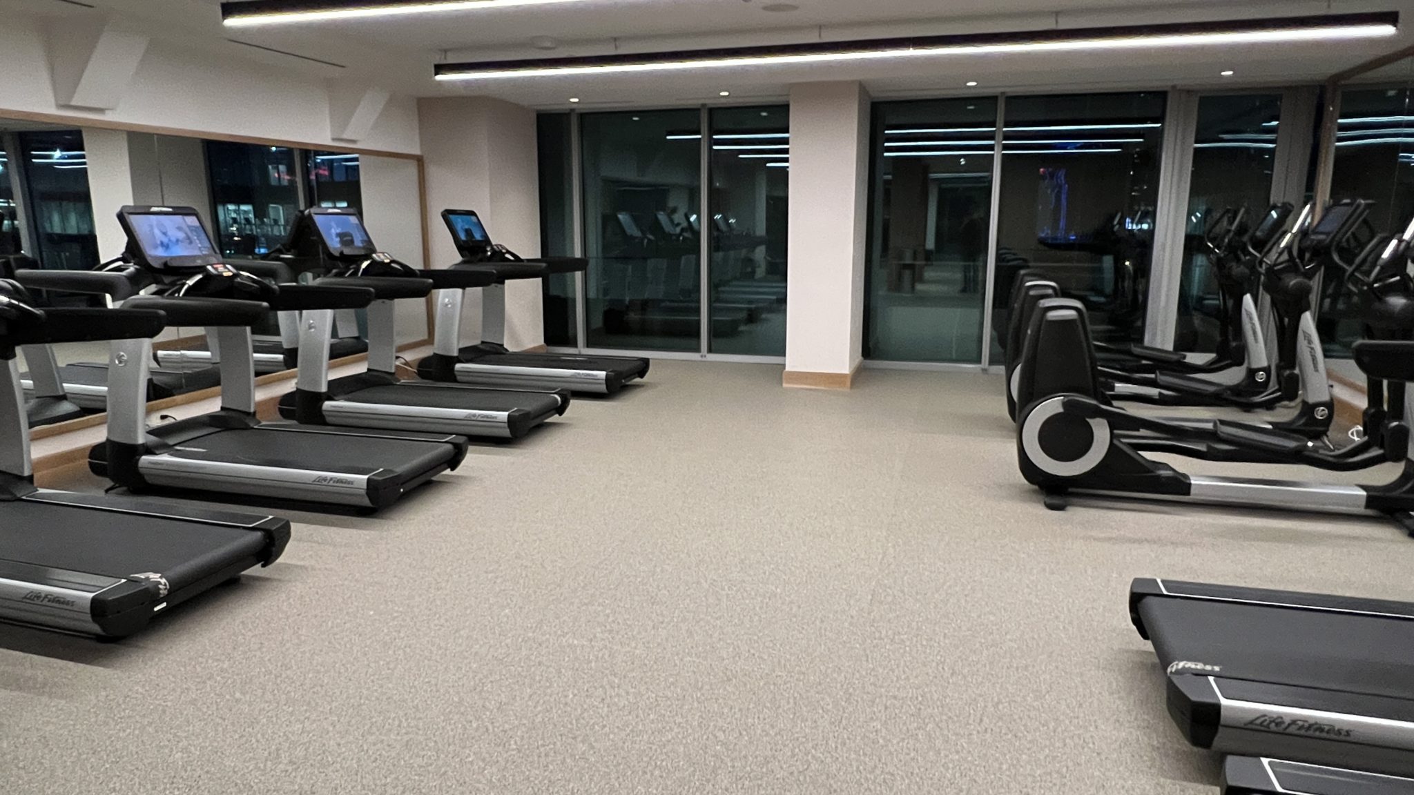 a gym with treadmills and exercise machines