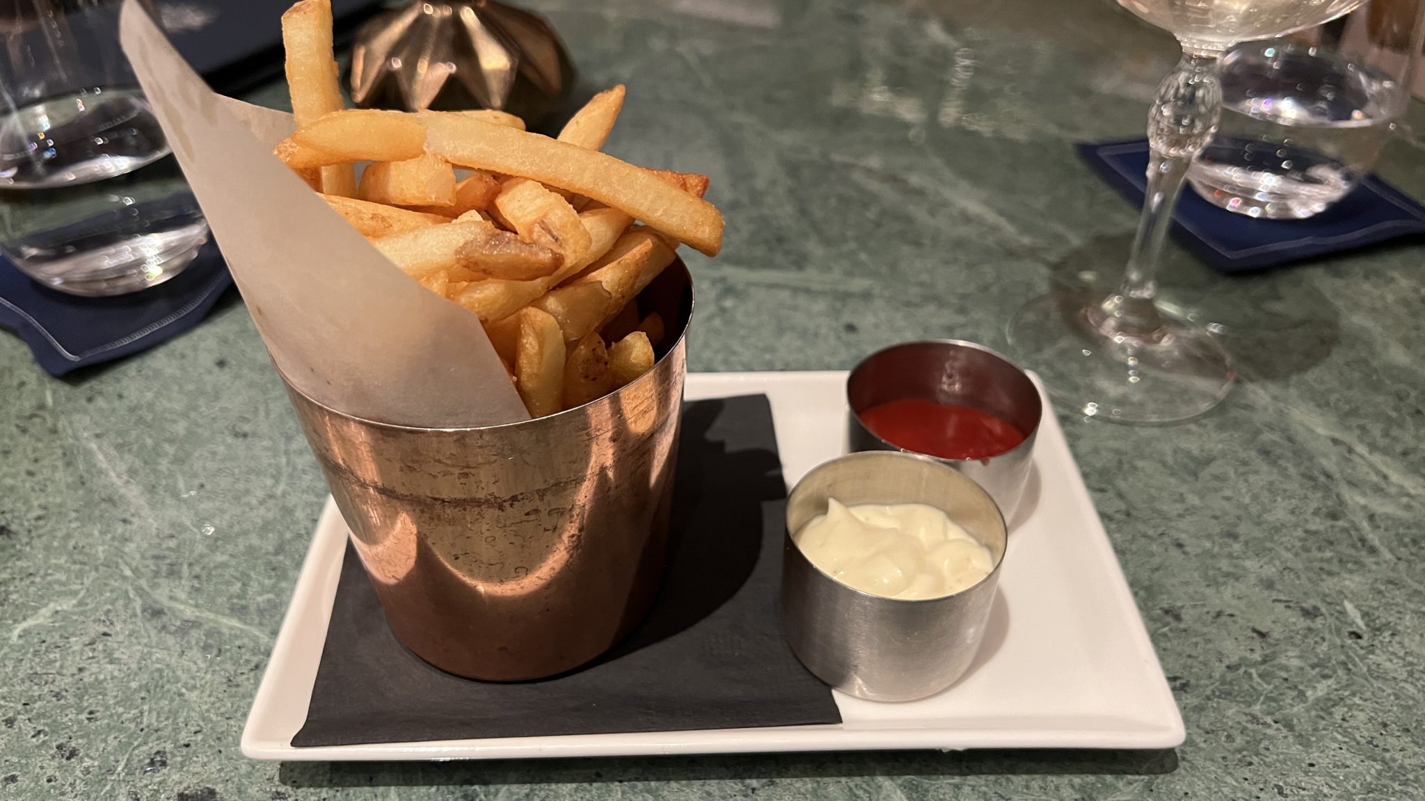 a plate of french fries and sauces