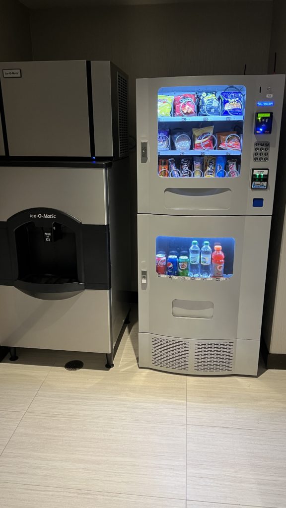 a vending machine with snacks and drinks