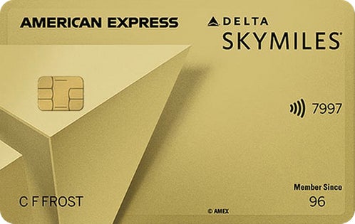 a credit card with a gold and black logo