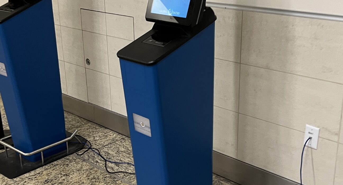 a blue rectangular machine with a screen on it
