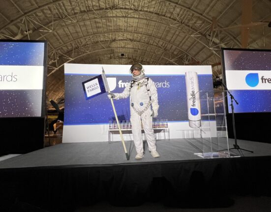 a person in a space suit on a stage