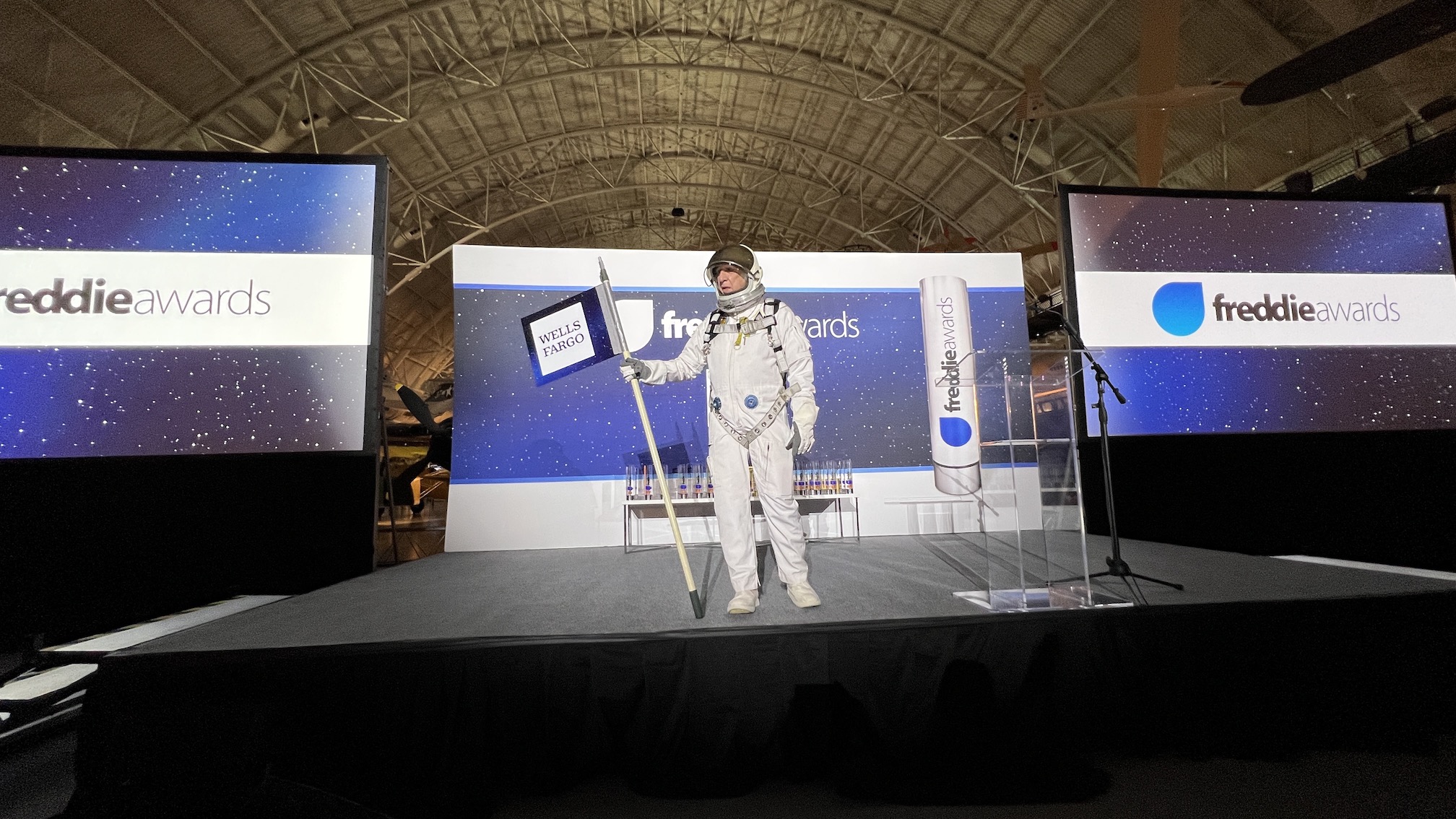 a person in a space suit on a stage