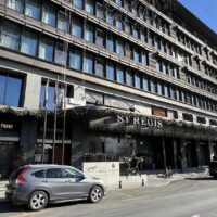 a building with cars parked on the side of it