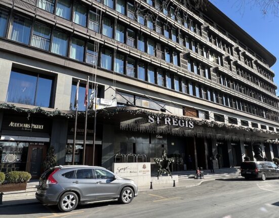 a building with cars parked on the side of it