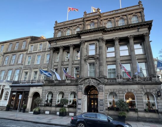 a building with flags on top of it