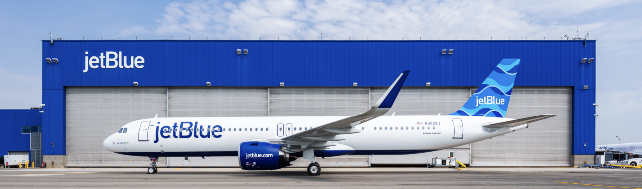 a jet plane parked in front of a building