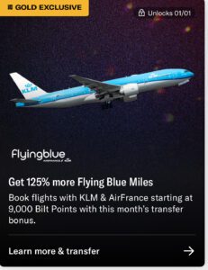 a blue and white airplane flying in the sky