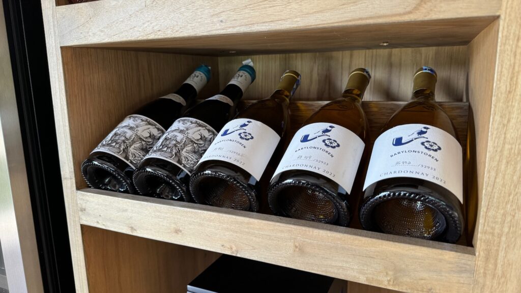 a row of wine bottles on a shelf