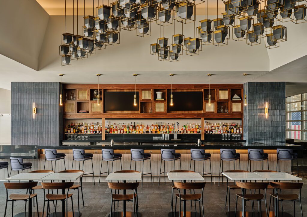 a bar with tables and chairs