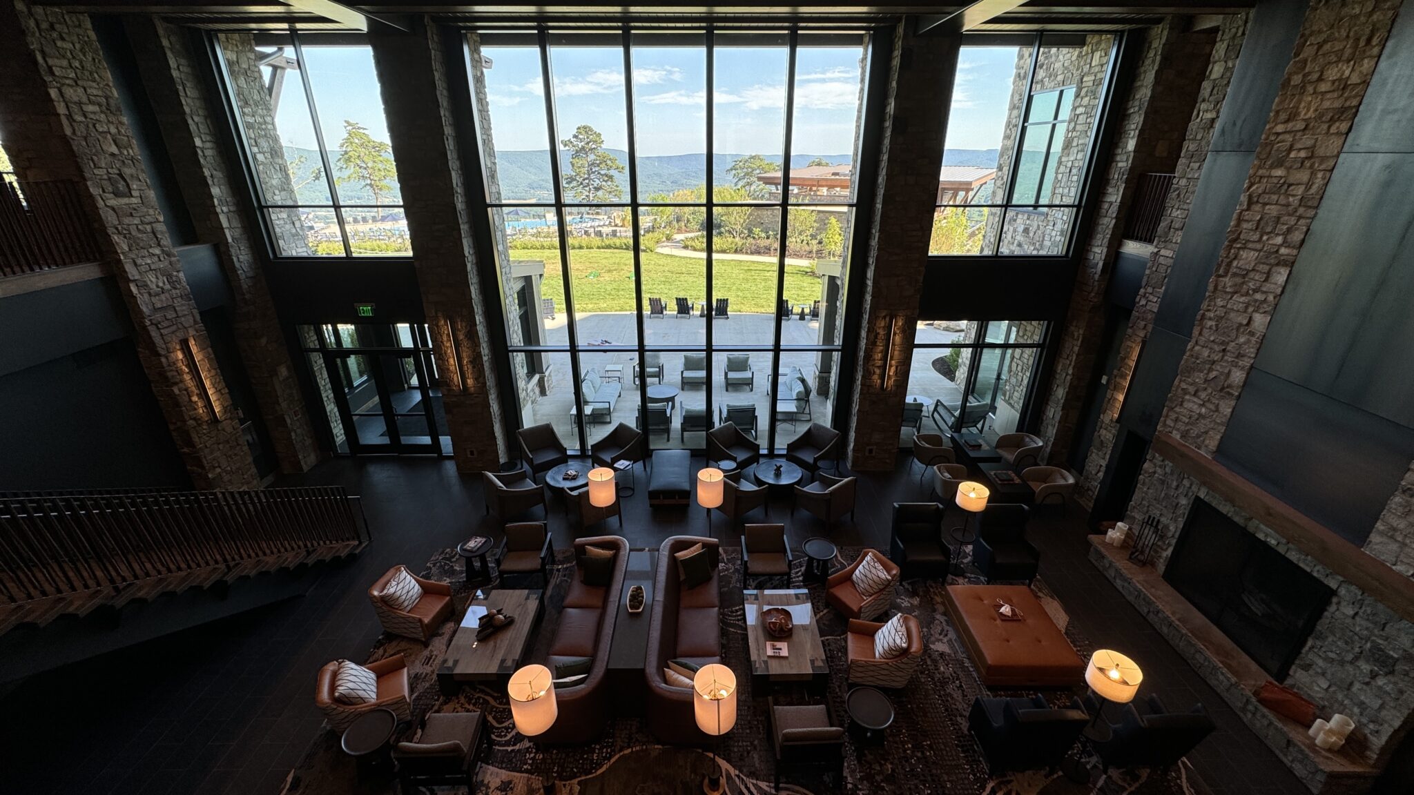 a room with a large window and a view of the water and a lake