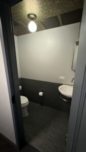 a bathroom with a toilet and sink