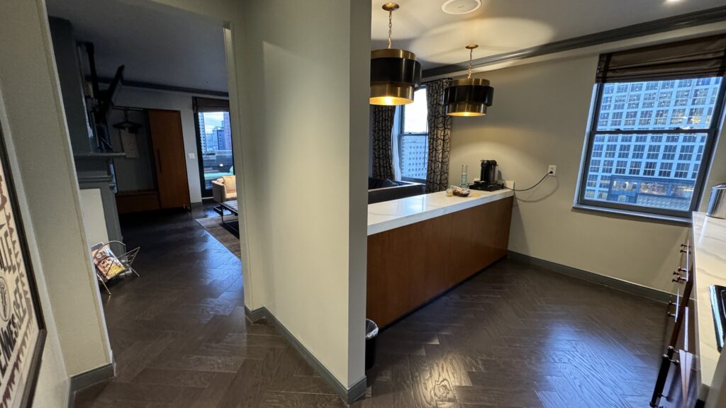 a room with a bar and a wood floor