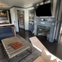 a living room with a fireplace and a couch