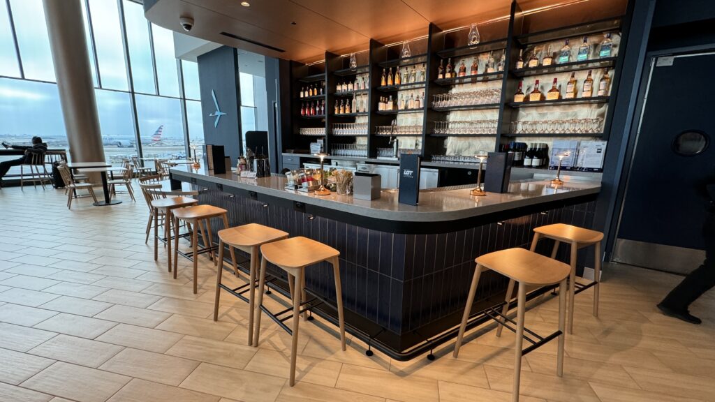 a bar with shelves of liquor and bottles