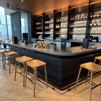 a bar with shelves of liquor and bottles