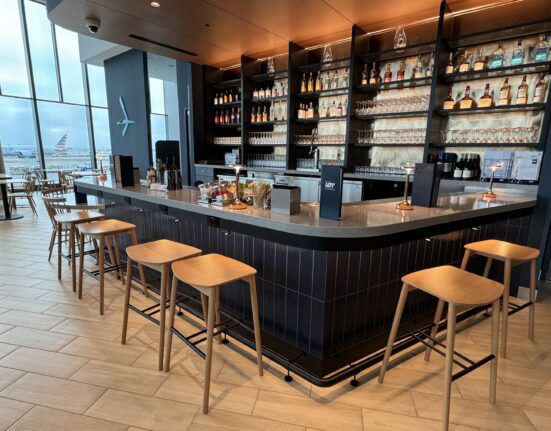 a bar with shelves of liquor and bottles