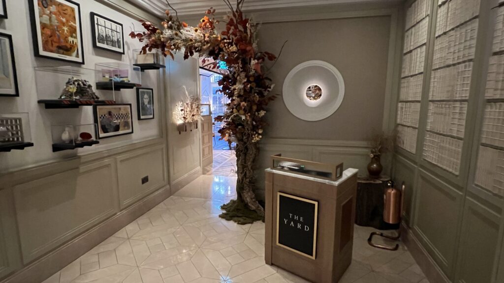 a room with a tree and a podium