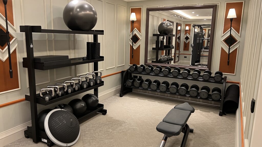 a room with a mirror and weights