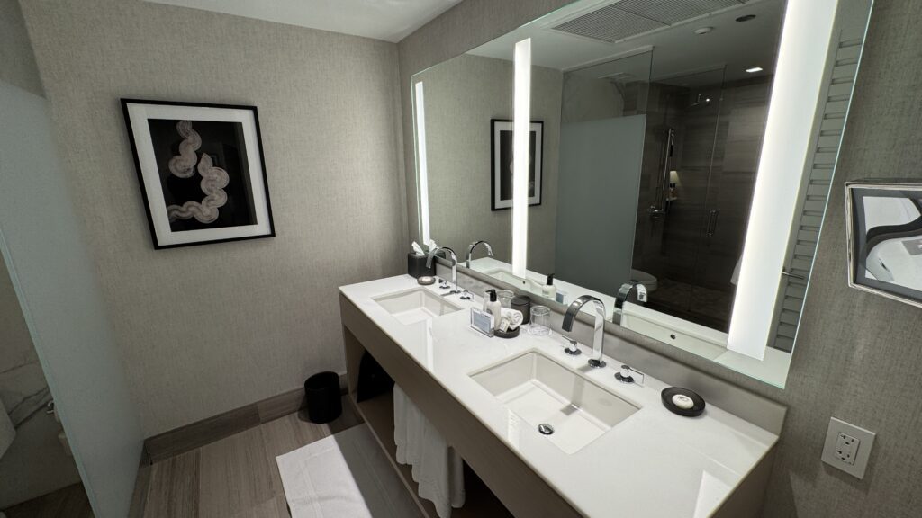 a bathroom with a large mirror and sink