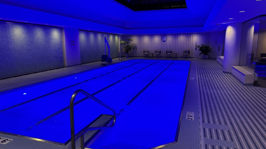 a swimming pool with blue lights