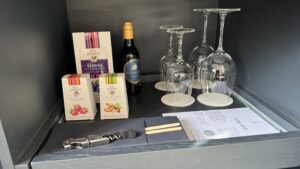 a table with wine glasses and bottles