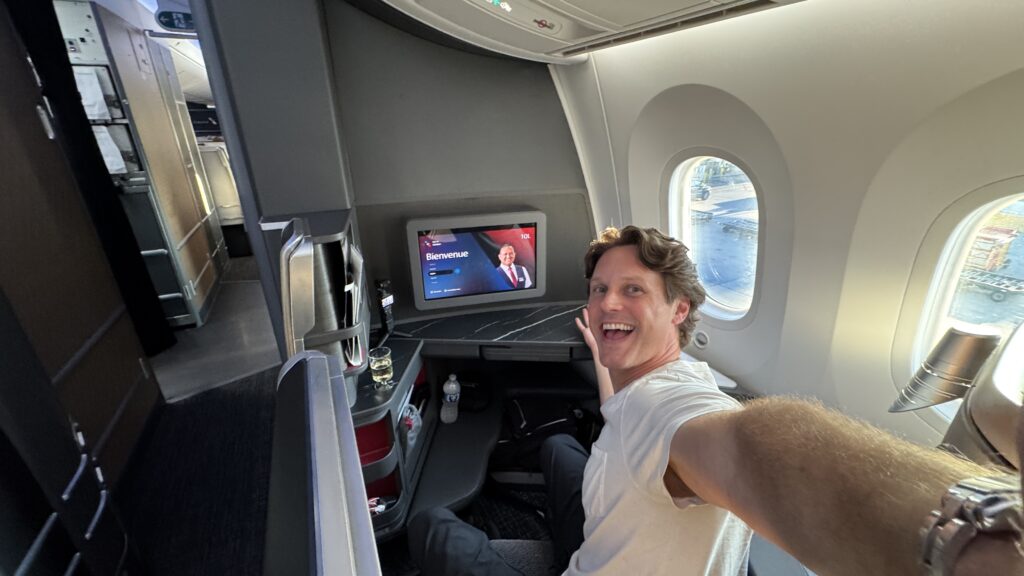 a man taking a selfie in an airplane