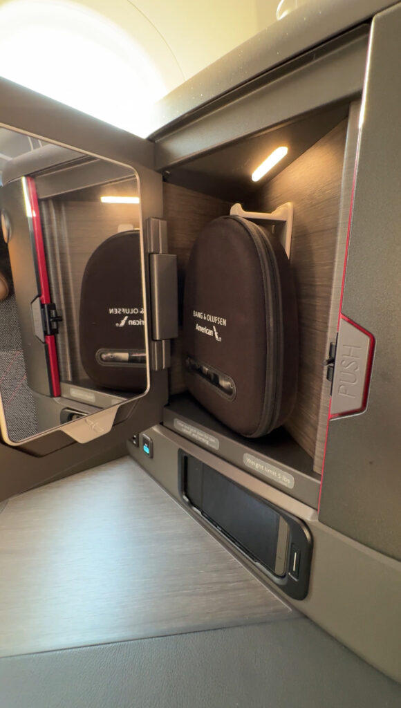 a small mirror in a small cabinet