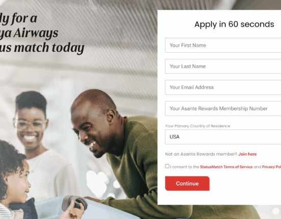 a man and woman looking at a computer screen